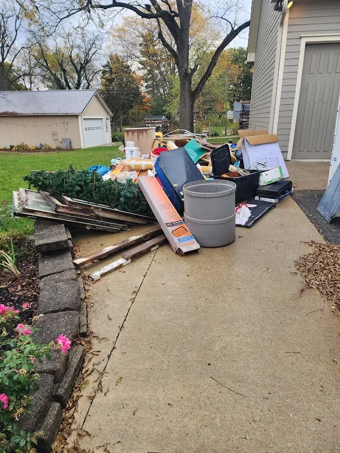 Dumpster being loaded with debris for Residential Dumpster Rental in Leesburg